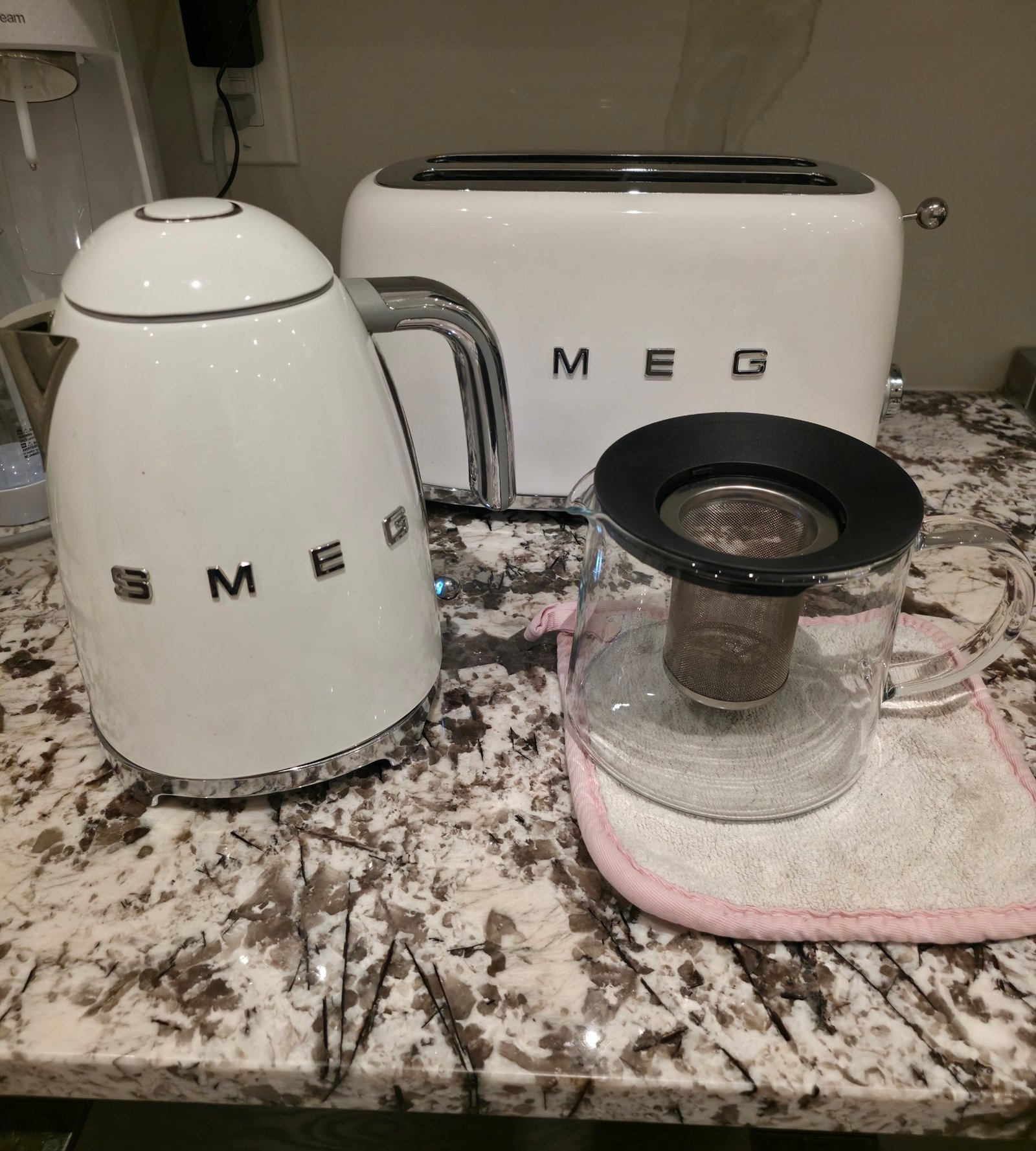 IKEA RIKLIG teapot showing the removable infuser basket hanging well short of the pot's bottom